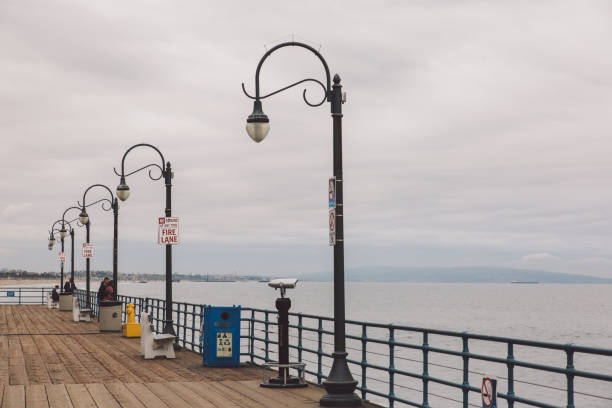 istock Street Light By Sea Against Sky 748613735