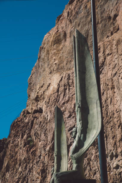 Low Angle View Of Statue Against Rocky Mountain At Hoover Dam Photo Taken In United States, Boulder City hoover dam statues stock pictures, royalty-free photos & images