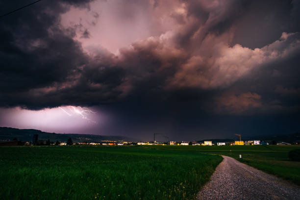 istock Scenic View Of Field Against Storm Clouds 750587051