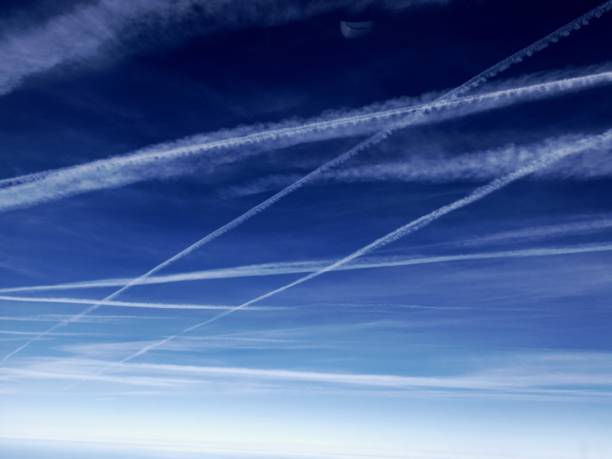 istock Low Angle View Of Vapor Trail In Blue Sky 752160091