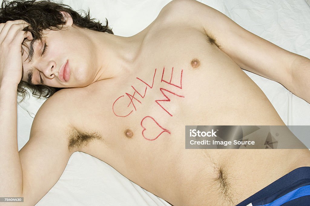 Teenage Boy With Writing On Chest Stock Photo - Download Image Now - The Morning After, Bed - Furniture, Bedroom - iStock Teenage Boy With Writing On Chest Stock Photo - Download Image Now - The Morning After, Bed - Furniture, Bedroom - iStock