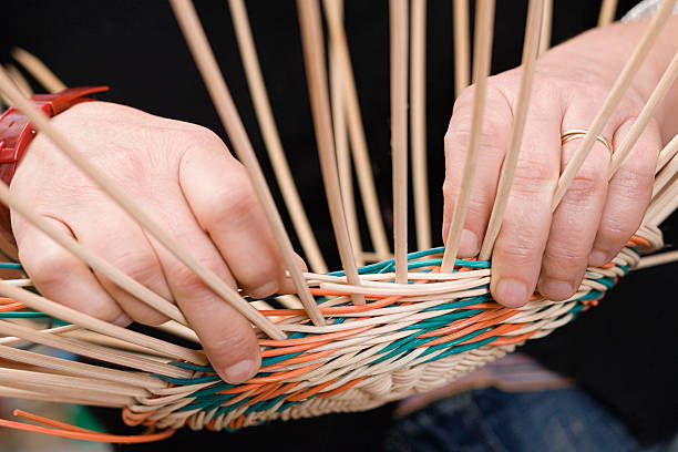 Person making basket  basket weaving stock pictures, royalty-free photos & images