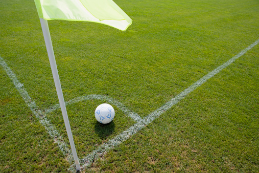soccer ball in the center of the field at the start of the game