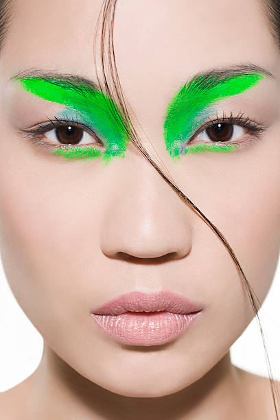 Woman with bright green eyeshadow  crazy makeup stock pictures, royalty-free photos & images