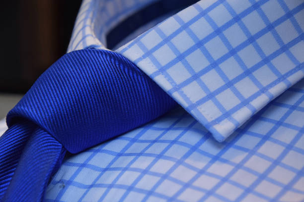 istock Close-Up Of Blue Necktie On Checked Pattern Shirt At Store 755762185