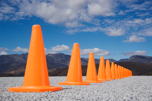 Road traffic cone on asphalt. Digitally Generated Image
