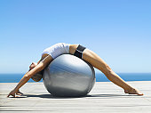 Woman working out with an exercise ball