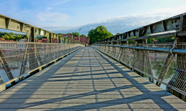 istock Diminishing View Of Footbridge Over River 758479731