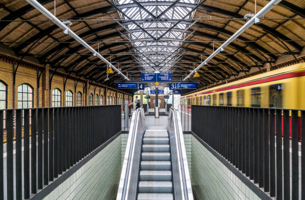 istock Escalator Amidst Railings At Railroad Station 758483593