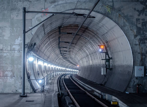 istock Railroad Track In Illuminated Tunnel 758483887