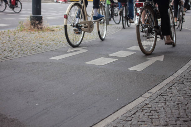 istock Low Section Of People Riding Bicycle On Street 758488291