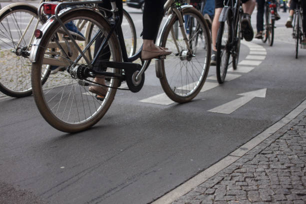 istock Low Section Of People Riding Bicycle On Street 758528897