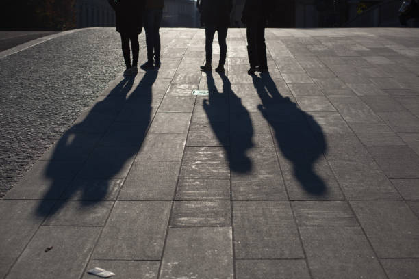 istock Low Section Of People On Street During Sunny Day 758537125