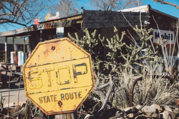 istock Stop Sign Against Plants During Sunny Day 758585437