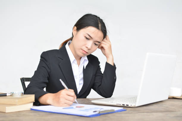 istock Businesswoman Working At Desk Against White Background 758619341