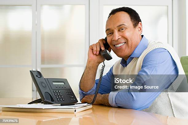 Man On Telephone Stock Photo - Download Image Now - Desk, Men, Telephone Receiver