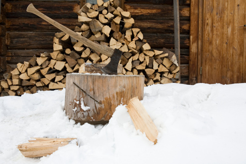 A stack of chopped firewood stacked outside in winter in Iowa City, Iowa, United States