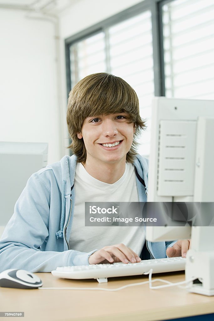 Boy using computer  Boys Stock Photo
