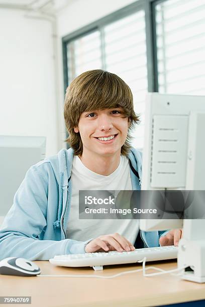 Boy Using Computer Stock Photo - Download Image Now - Boys, Technology, Teenage Boys