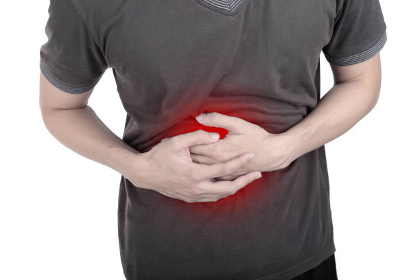 istock Midsection Of Man With Stomachache Standing Against White Background 760227449