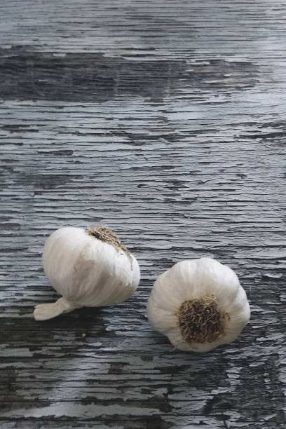 istock High Angle View Of Garlic Bulbs On Old Wooden Table 760257777