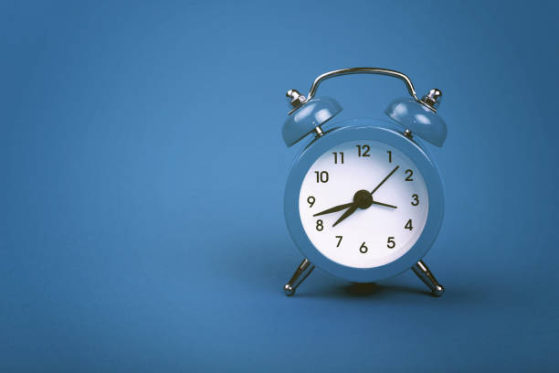istock Close-Up Of Clock Against Blue Background 763270575