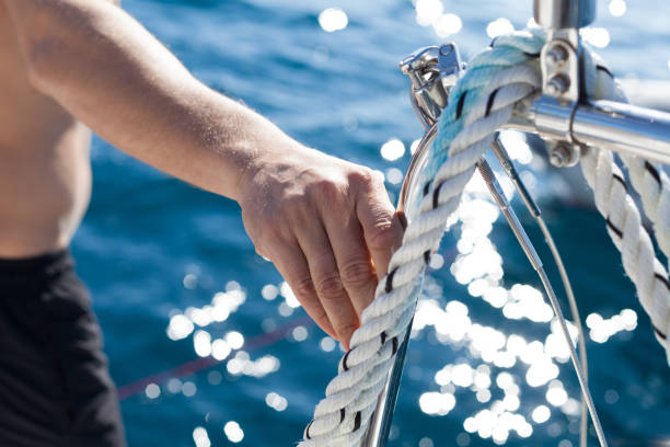 istock Midsection Of Man Sailing In Sea 763277063