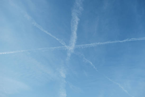 istock Low Angle View Of Vapor Trails In Blue Sky 763281505