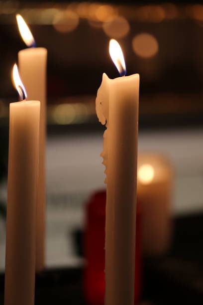 istock Close-Up Of Burning Candles On Table 767981865