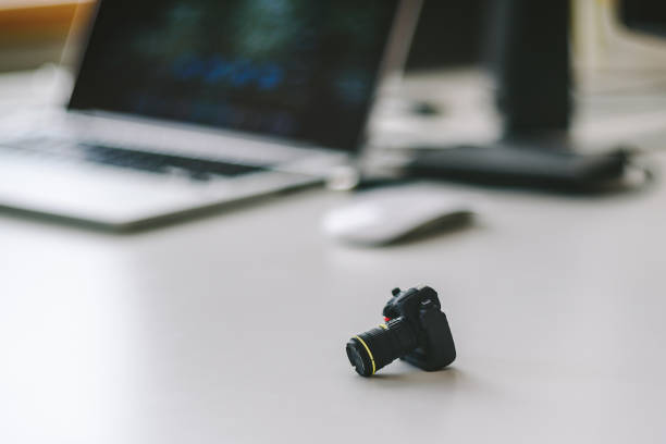 istock Close-Up Of Miniature Toy Camera On Table 767988667