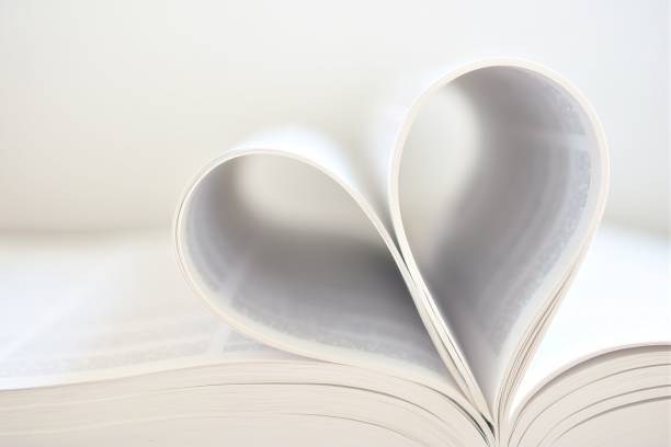 istock Close-Up Of Heart Shape On Book Against White Background 767989201