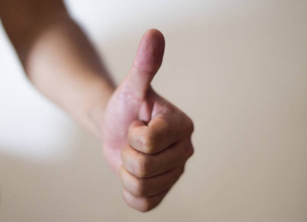 istock Cropped Image Of Hand Gesturing Thumbs Up 767998589