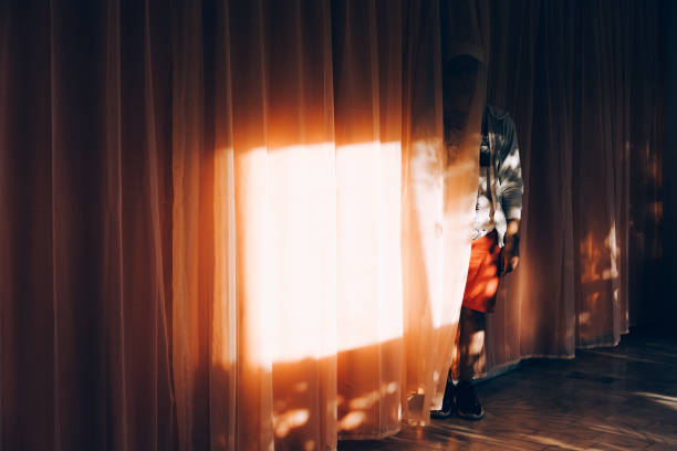 istock Man Standing By Curtain At Home 768022795