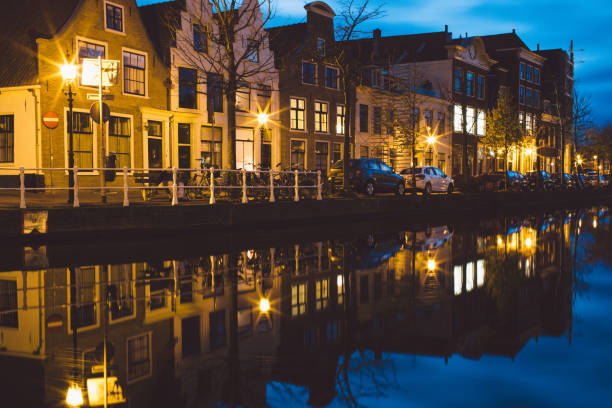 istock Reflection Of Illuminated Buildings In Water At Night 768091721
