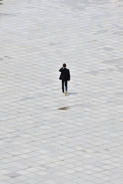 istock Full Length Rear View Of Man On Walkway 769809379