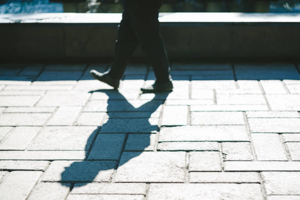istock Low Section Of Man Walking On Street 769816127