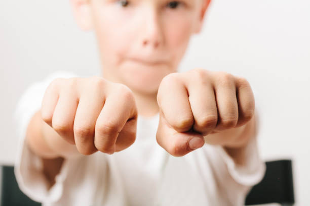 istock Boy Showing Fist Over White Background 769832415