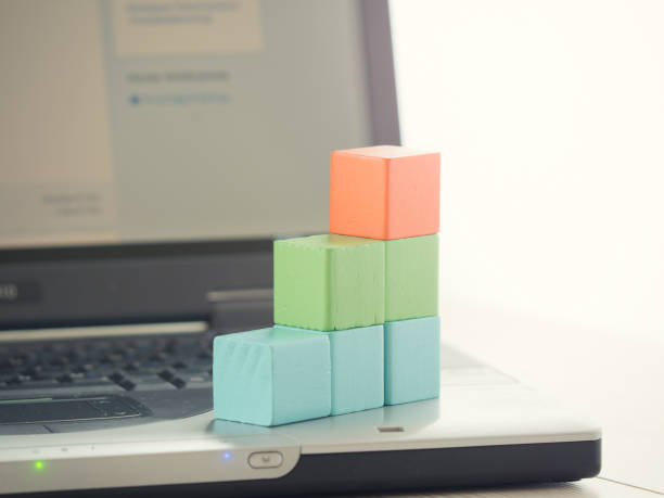 istock Close-Up Of Multi Colored Toy Blocks On Laptop 771499151