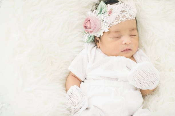 istock High Angle View Of Cute Baby Boy Sleeping On Bed 771532911