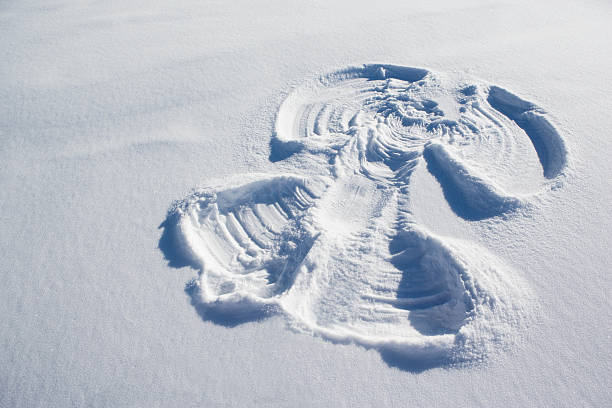 A snow angel  snow angels stock pictures, royalty-free photos & images