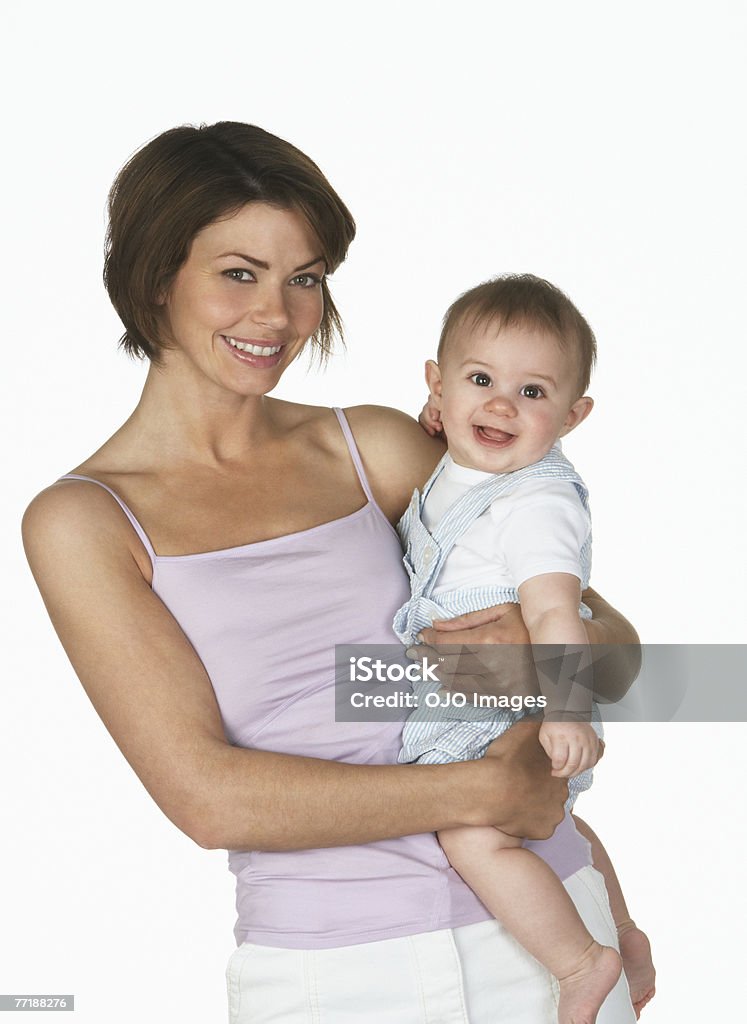 Uma mulher segurando um bebê - Foto de stock de Fundo Branco royalty-free