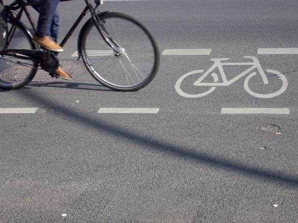 istock Low Section Of Man Riding Bicycle On Street 773121061