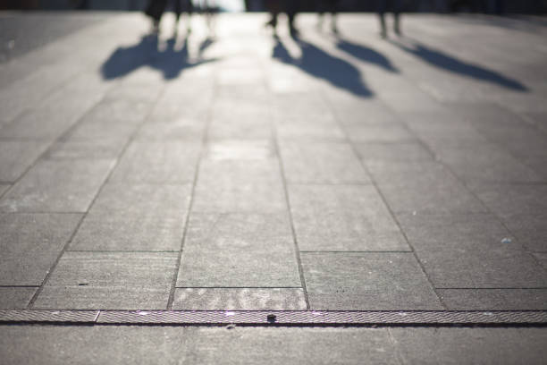 istock Low Section Of People Walking On Sidewalk 773121845