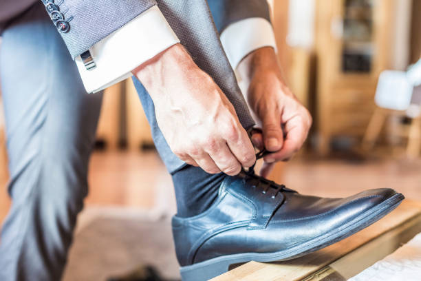 istock Low Section Of Man Tying Shoelace 773126811