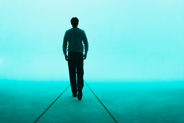 Man walking away  back lit stock pictures, royalty-free photos & images