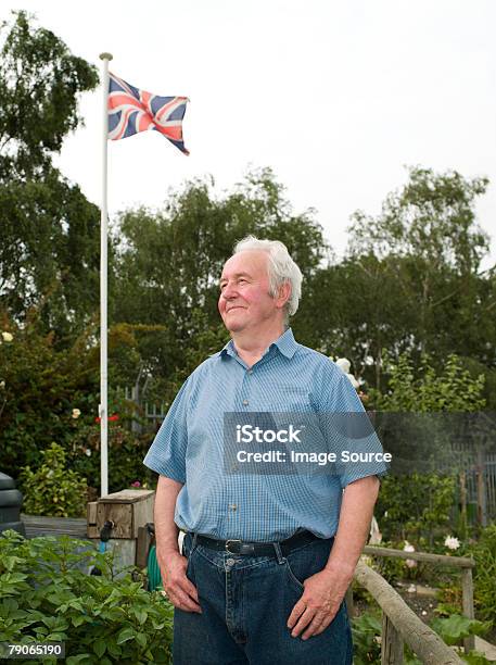 Portrait Of A Senior Man Stock Photo - Download Image Now - Community Garden, Flagpole, Gardening