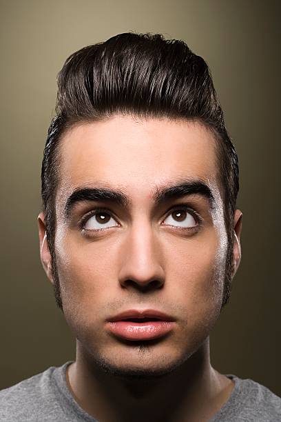 Man looking up at his hair  rockabilly hair men stock pictures, royalty-free photos & images