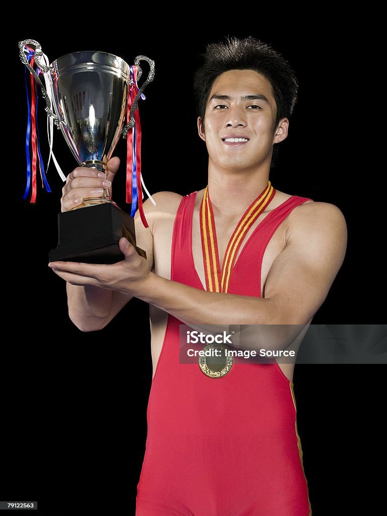 Man holding trophy  Weightlifting Stock Photo