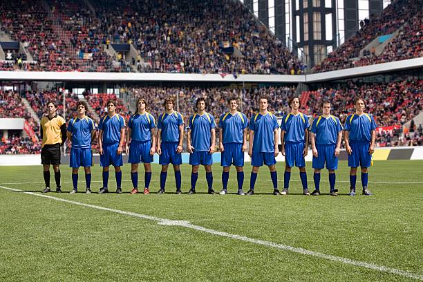 Footballers in a row  stadium photos stock pictures, royalty-free photos & images
