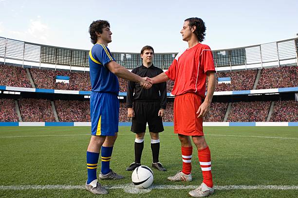 Opposite football player shaking hands  referee stock pictures, royalty-free photos & images